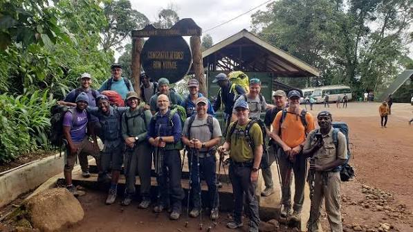 Successful trekkers checking out at Mweka Gate after completing their Mount Kilimanjaro climbing tour